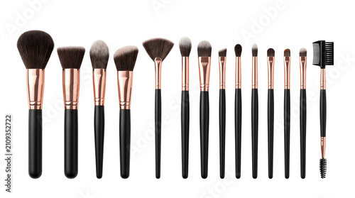 Professional makeup brush set with black handles and rose gold ferrules isolated on white background