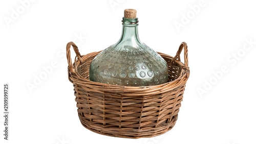 Bild auf Leinwand Large empty glass carboy bottle inside wicker basket container isolated on trans