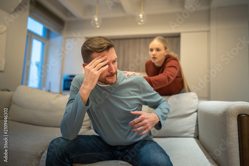 Obraz na plátne Deeply offended nervous husband in disappointment refusing contacting with worried woman, misunderstanding and frustration after arguing, manipulations in couple relationships, conversation failure