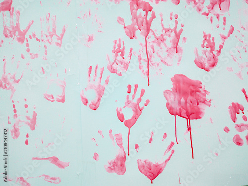 Abstract watercolor background. Pink Handprints and Drips on a Light Surface Background.