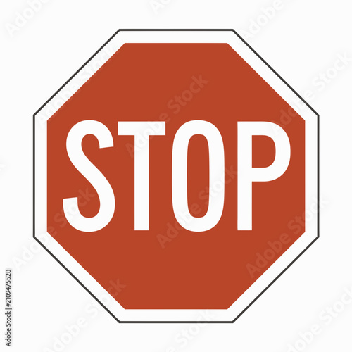 Stop sign features a bold red octagonal shape with sharp white letters against a clean and flat background.