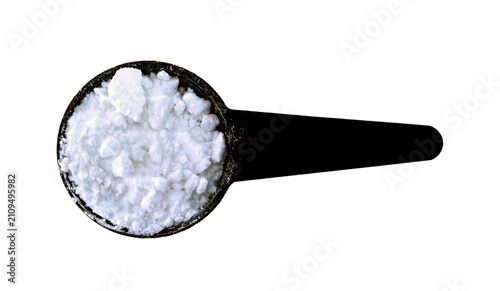 Creatine Powder in Black Scoop Seen from Above Isolated