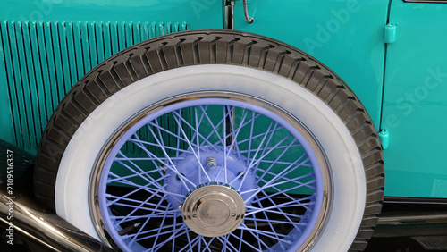 Fotografie A spare whitewall tire on a vintage car