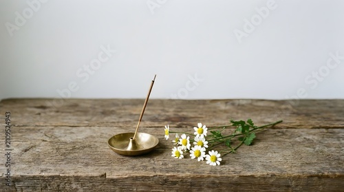 Meditation Candle and Daisy Flowers on Rustic Wooden Surface for Calmness