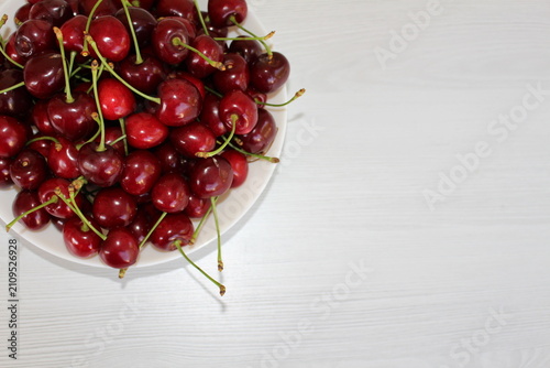Konstfotografi There's a plate full of sweet natural cherries from my tree on the table