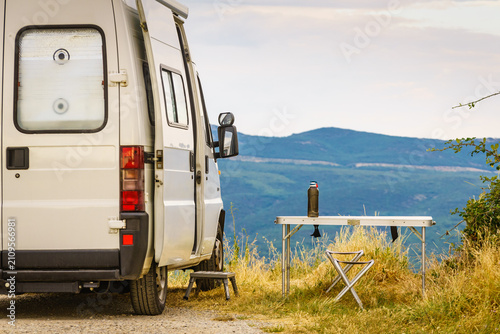 Camping van and table in Verdon Gorge, Alpes-de-Haute-Provence, France.