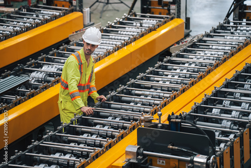 Industrial Technician Works on Metal Production in Steel Factory Setting