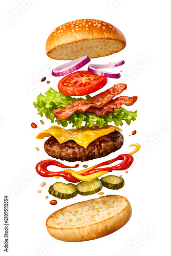Deconstructed hamburger ingredients falling dynamically .