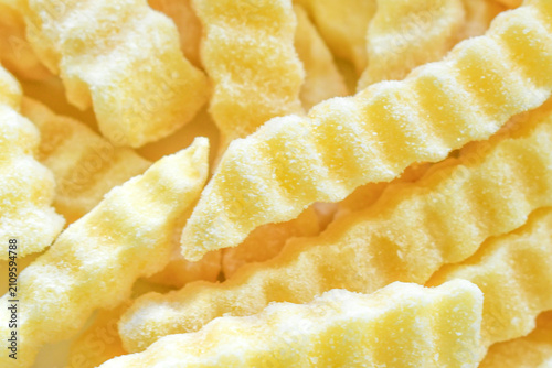 Frozen crinkle cut chips on a plate.