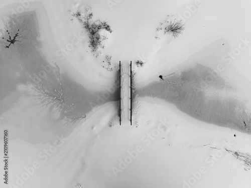 snow covered bridge and ice from above