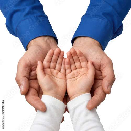 Adult hands holding small child hands showing support and care.