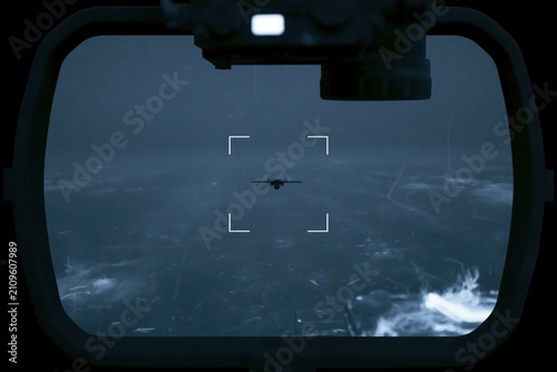 EO IR surveillance system tracking small military reconnaissance UAV over open sea during long range maritime security monitoring