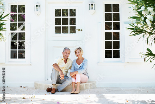 Bild auf Leinwand Senior, couple and happy at front door for real estate, long term investment or home security