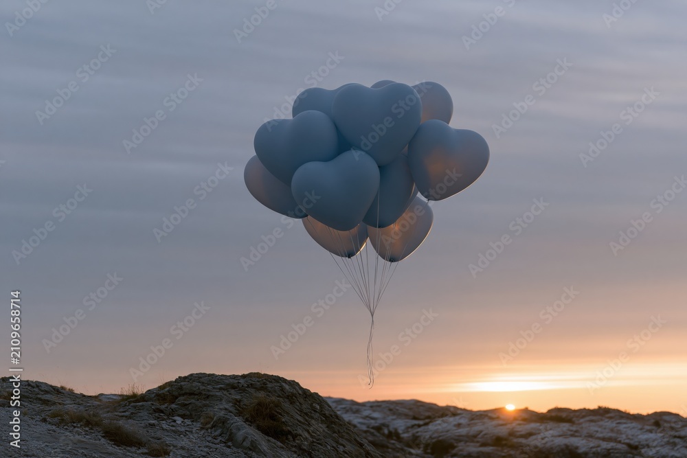 Fototapeta premium Floating bundle of heart shaped balloons over coastal rocks at sunrise background for romantic banner and pastel wallpaper design