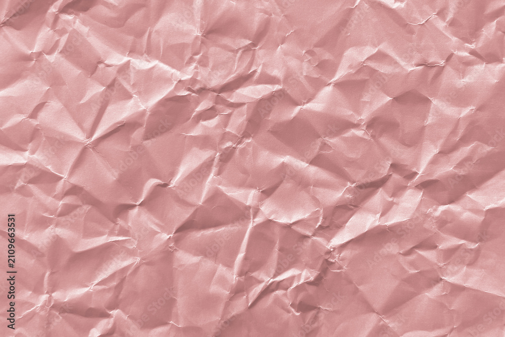 Fototapeta premium Textured pink crumpled paper background