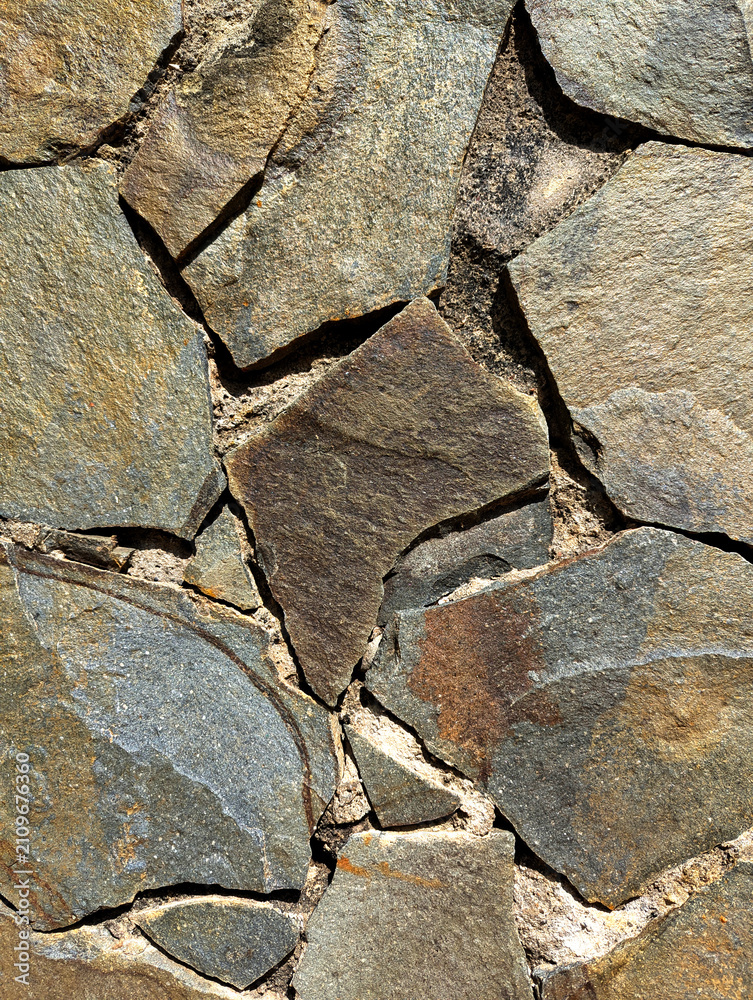 Fototapeta premium Natural Stone Wall Texture With Irregular Flagstone Pattern
