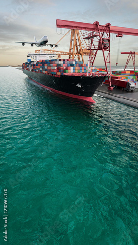 Container ship beside a busy cargo terminal