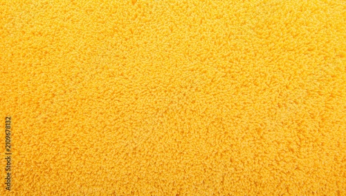 Fotografie Textured Yellow Towel in Closeup View with Soft Fibers