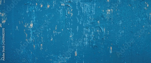 Obraz na plátně Textured Blue Wall Surface with Flaking Paint in Natural Light