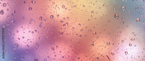 Colorful Abstract Background with Raindrops on Glass