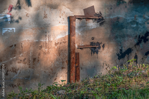 A fragment of the wall of an abandoned building on a summer day