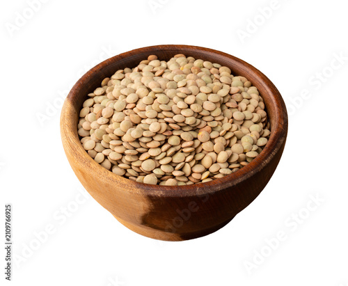 Raw lentils in a bowl isolated over white background