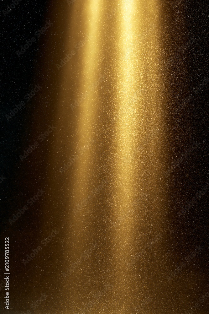 Fototapeta premium Abstract Gold Light Streams with Tiny Glitter Particles on Dark Background