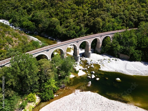 Aerial View of Historic Railway Bridge Crossing the Gardon River in Anduze, France