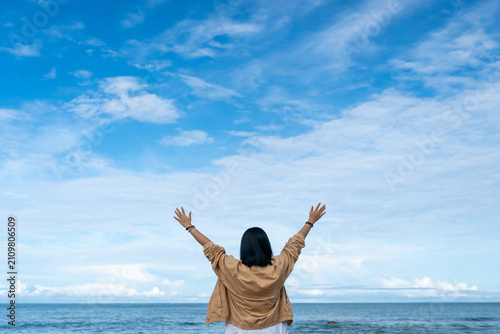 Bild auf Leinwand happy young woman jumping on the beach