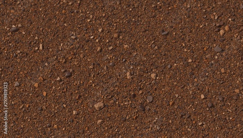 Brown Soil Texture with Small Rocks in Detailed Closeup