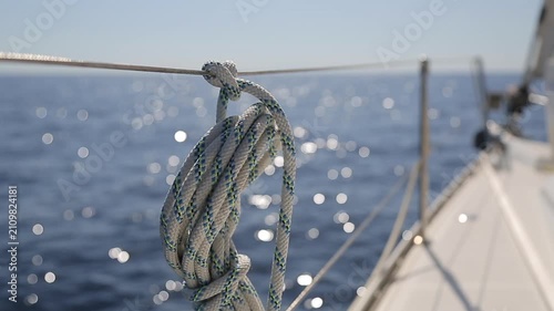 Close up of Yacht Rope on Guardrail with Sparkling Bokeh Sea in Corsica