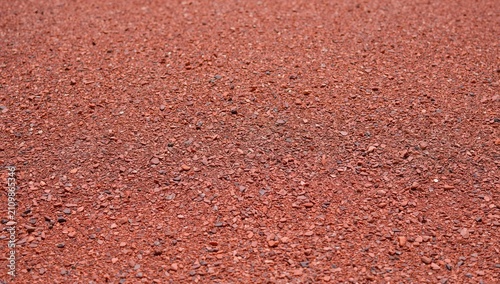 Red Gravel Ground Surface with Texture in Natural Light