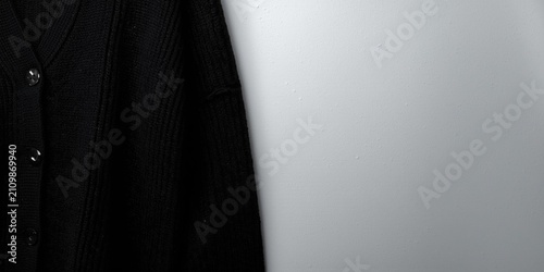Black Cardigan Hanging Agai...