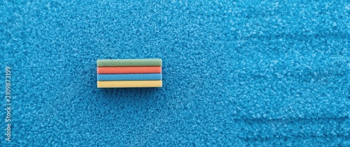 Colorful Eraser on Blue San...