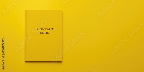 Yellow Contact Book on a So...