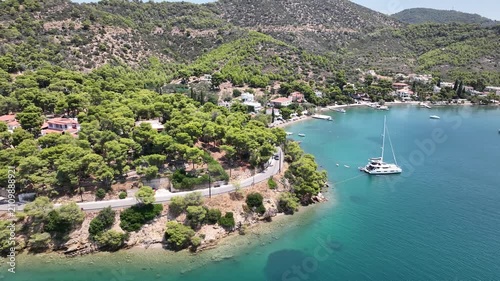 Cinematic Left Orbit Drone Shot Around Yacht in Turquoise Cove Near Poros, Greece on Sunny July Day