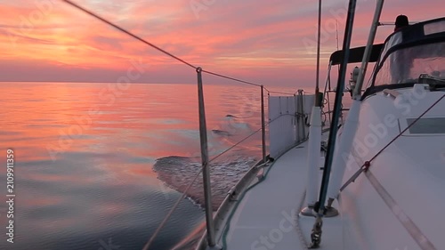 Sailing Yacht Cruising Mediterranean Sea at Sunrise in Corsica, low angle