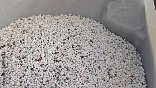 Konstfotografi Fertilizer pellets in a bucket.