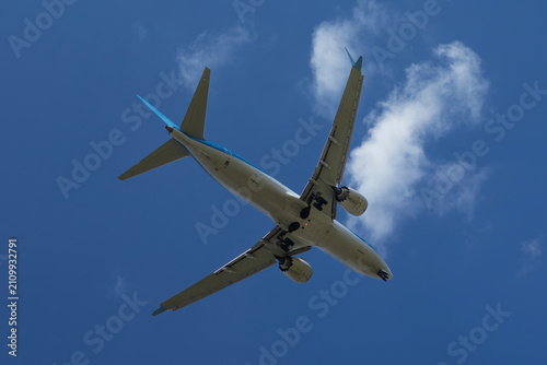 Bottom view of passenger airplane approaching Burgas airport