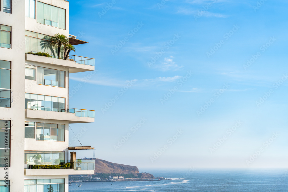 Fototapeta premium Modern high rise apartment balconies overlooking the Pacific Ocean in Barranco, Lima