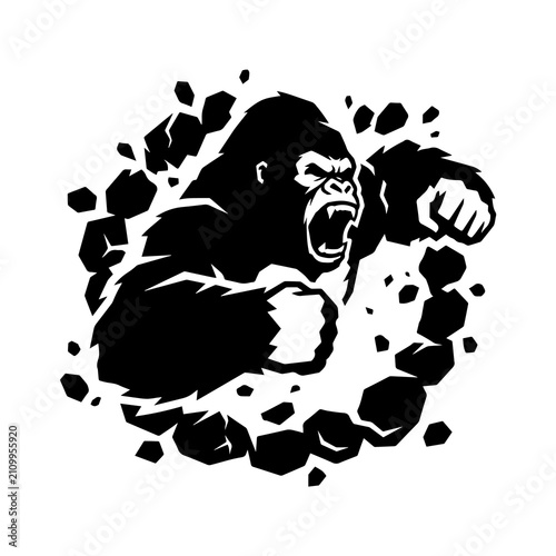 Wall Mural Powerful gorilla bust breaking through a stone wall black and white for mascot m