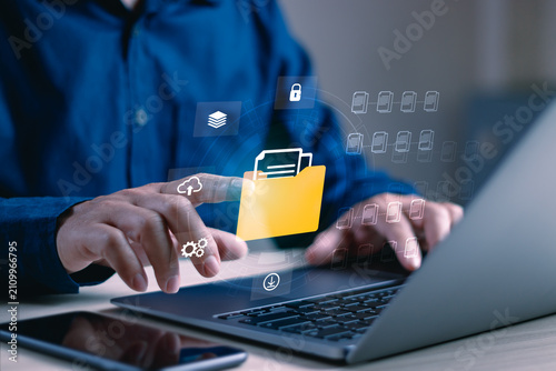 Businessman managing digital documents through a secure cloud file system, featuring document management, cloud storage, data security, file sharing, workflow automation and enterprise technology
