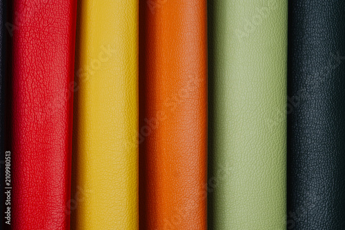 фотографія Colored leather samples arranged vertically with textured surfaces