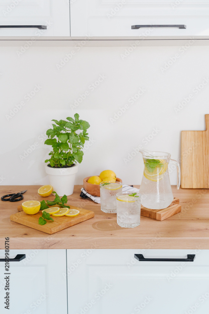 Fototapeta premium Fresh lemonade prepared with lemons and mint