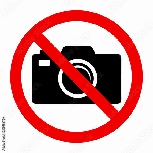 Red prohibition sign over camera icon indicating no photography allowed area