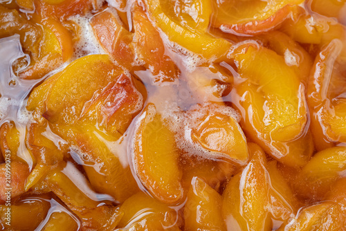 Homemade peach jam texture close up as natural fruit preserve background