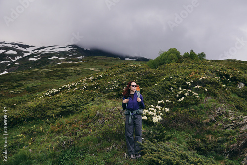 Photography A young woman in the mountains during hiking
