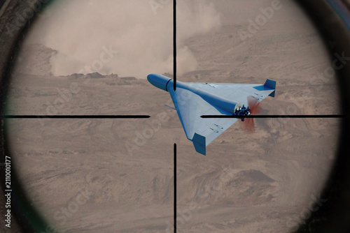 Canvastavla Military kamikaze drone inside crosshairs above an active combat zone