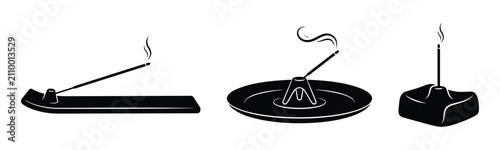 Incense stick holders set with aromatic joss sticks burning for relaxation and meditation.