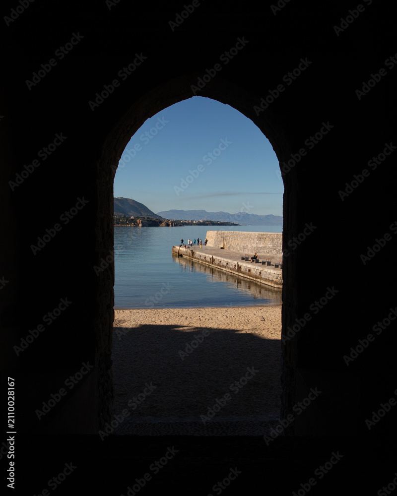Fototapeta premium Cefalu, Italy; 1st January 2026: Porta Pescara, one of the city's ancient medieval gates, offering a picturesque view of the sea.